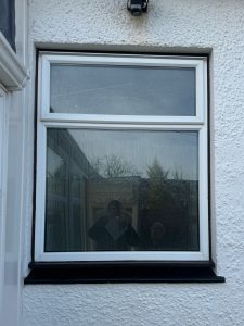 Old uPVC window with shattered glass Troon